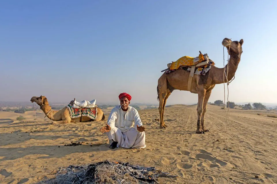 Camel safari adventure in the golden sand dunes of Rajasthan