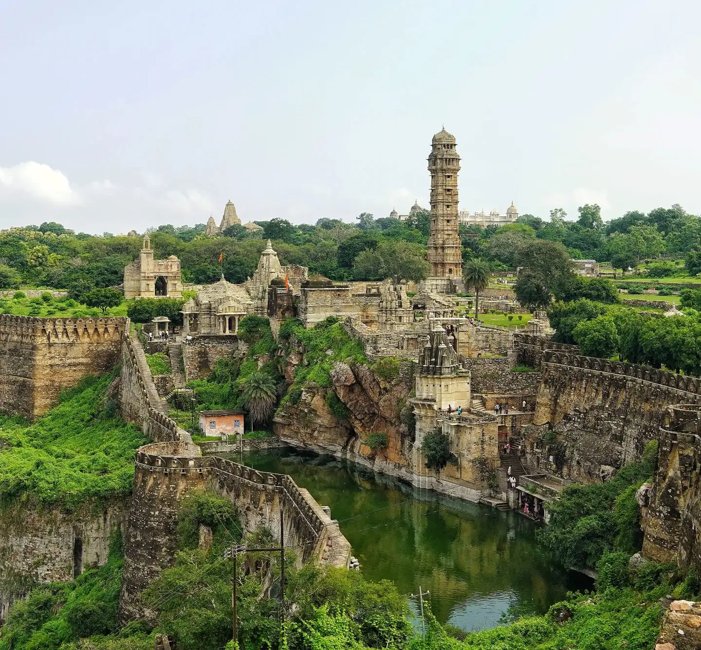 Wide view of Chittorgarh Fort in Rajasthan showcasing massive stone walls and historic Rajput architecture under a clear sky