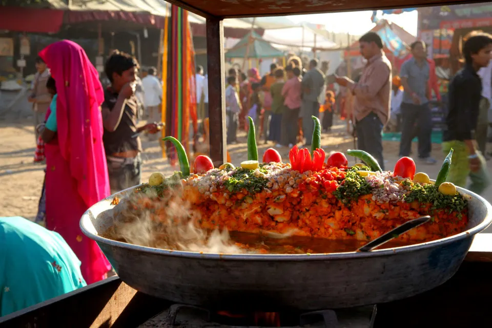 People enjoying vegetarian dishes at a scenic rooftop café