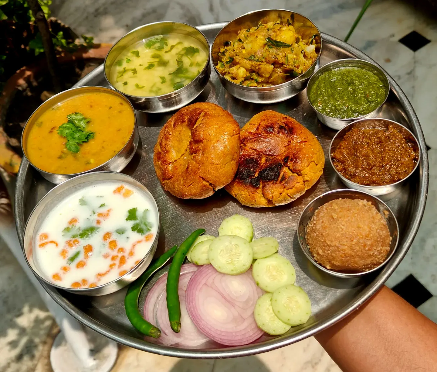 Authentic Rajasthani traditional dish Dal Baati Churma served with ghee