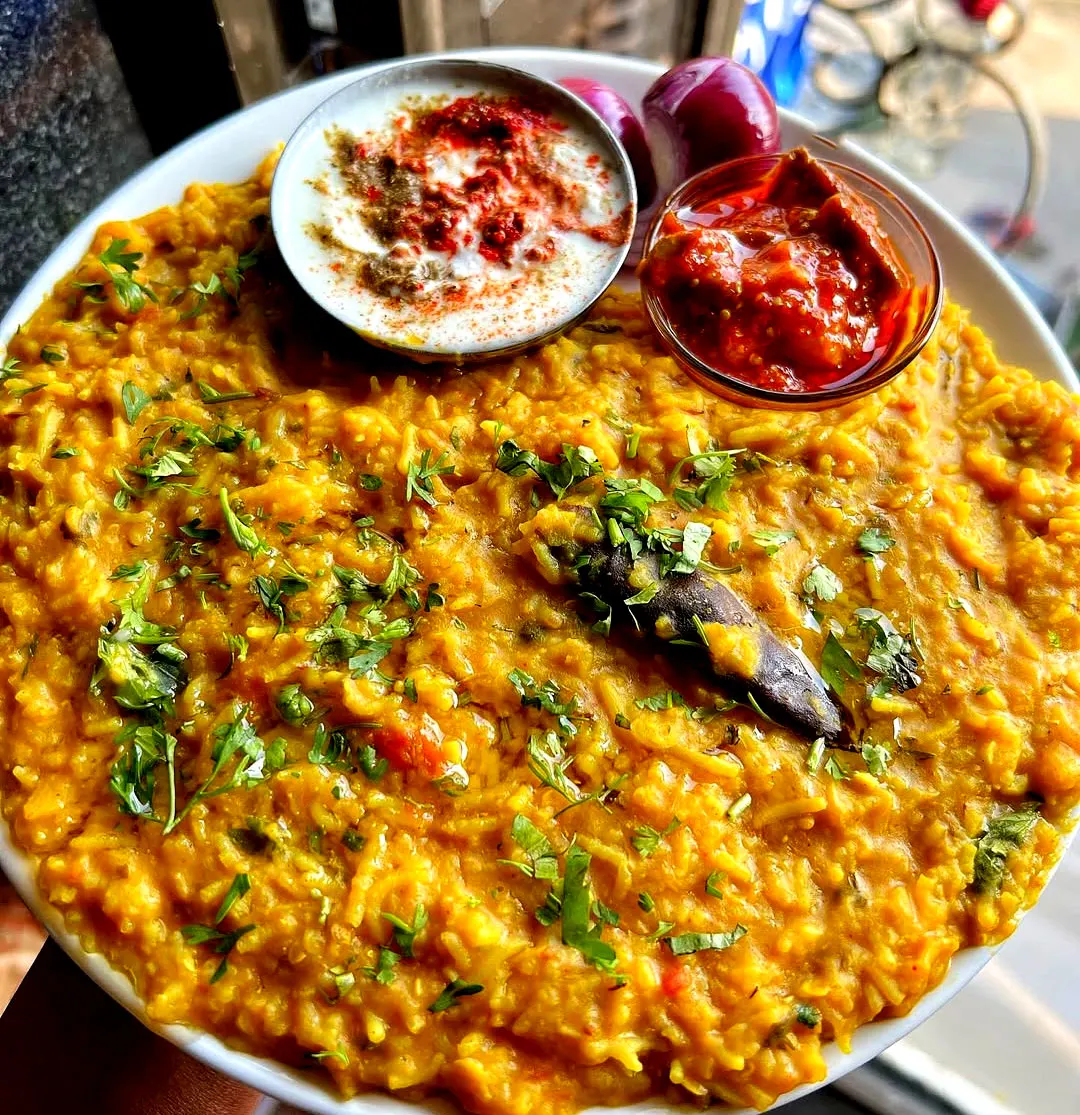 Traditional Rajasthani Khichdi served in a rustic Indian thali, authentic Rajasthani dish made with lentils and rice