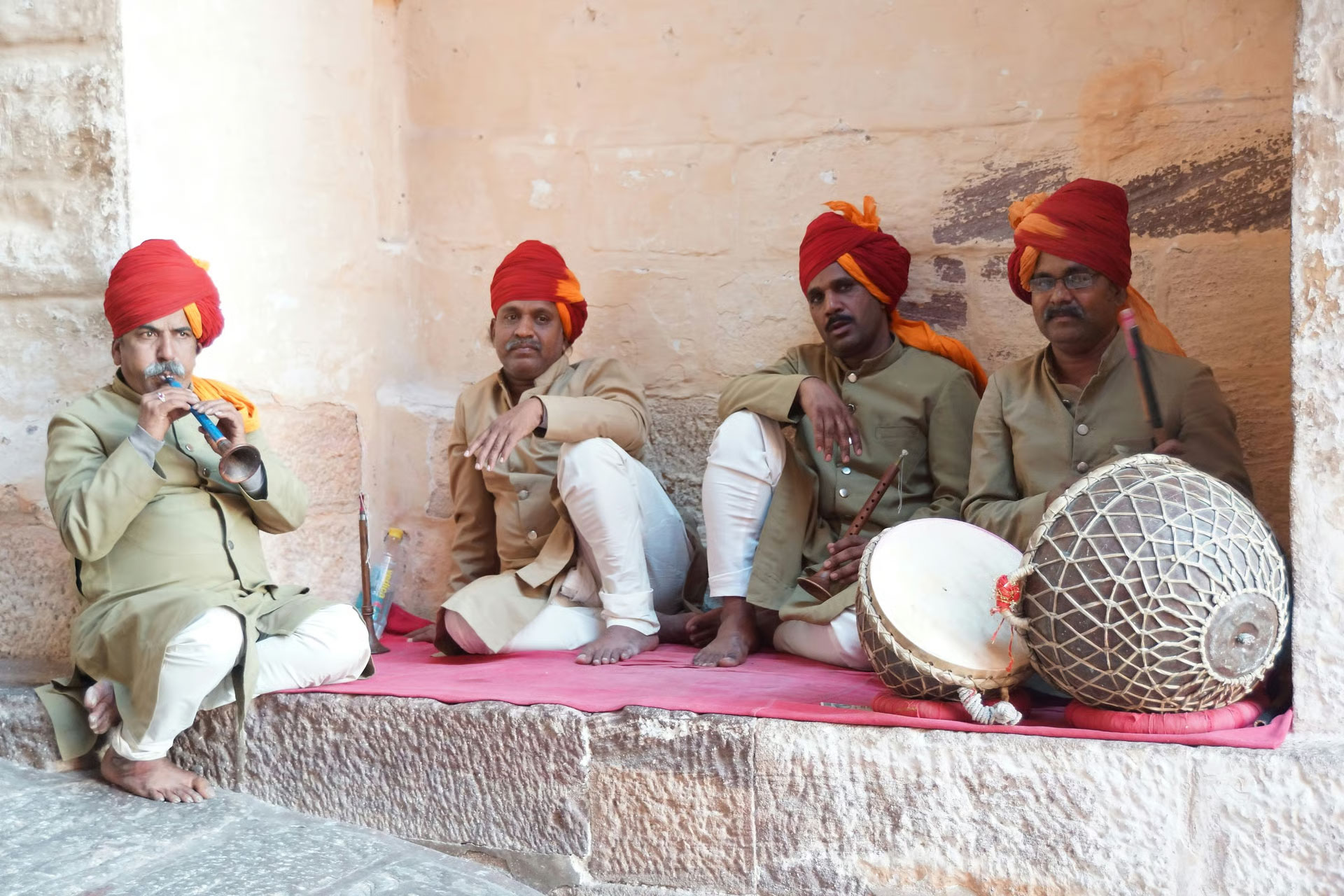 Rajasthan cultural tour featuring traditional attire, folk dance, and historic architecture.