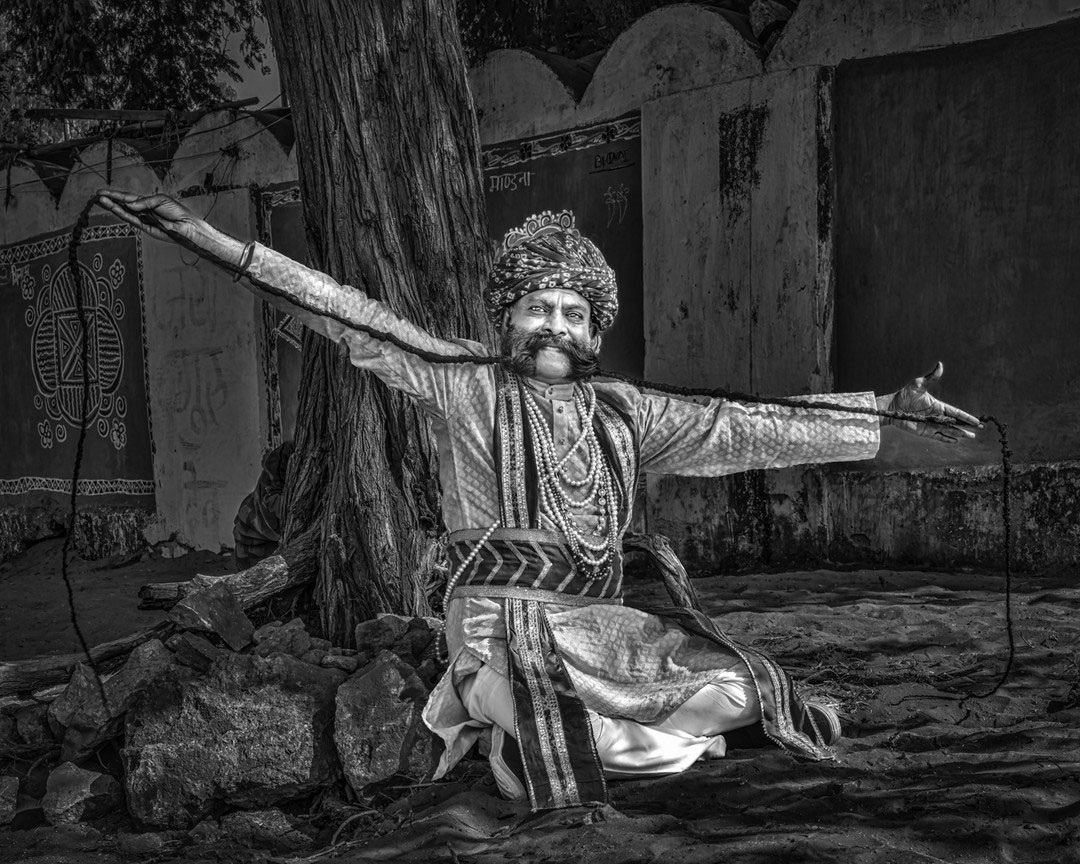 Nasring Chouhan with a thick, stylish moustache, exuding confidence and charm.