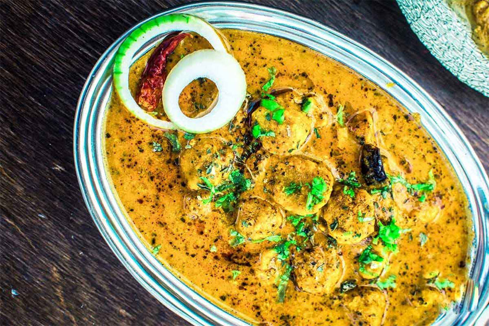 Traditional Rajasthani Gatte ki Sabzi in a bowl with aromatic spices