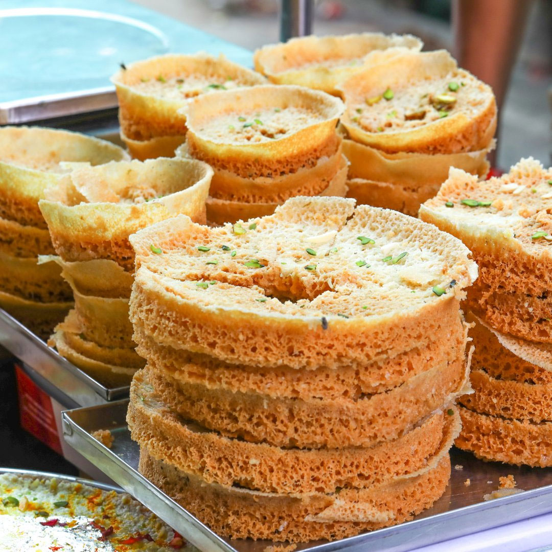 Traditional Rajasthani Ghewar sweet dessert on a plate