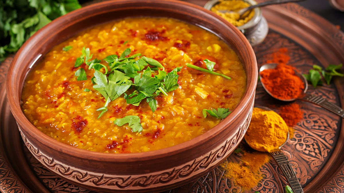 Rajasthani Panchmel Dal served in a bowl with spices on top