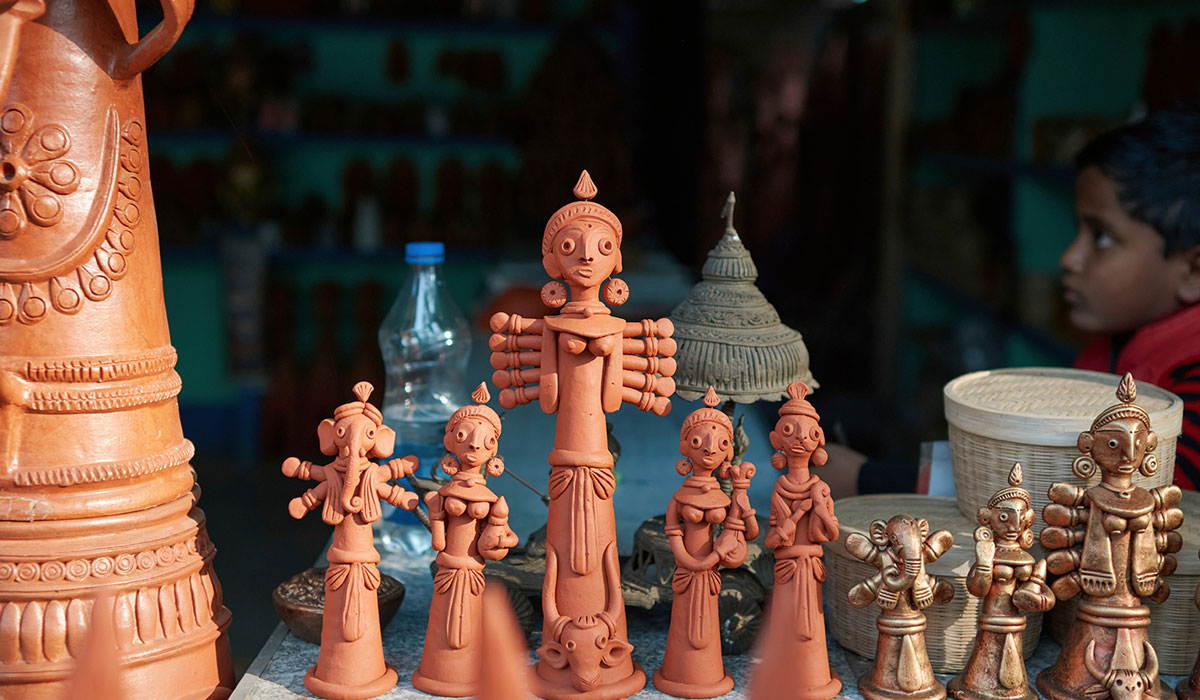 Authentic handmade terracotta pottery with intricate designs and earthy textures.